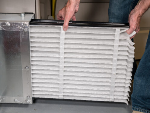 Man changing the furnace filter