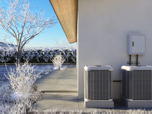 Close-up View Of Air Conditioning Outdoor Units In Snowy Garden
